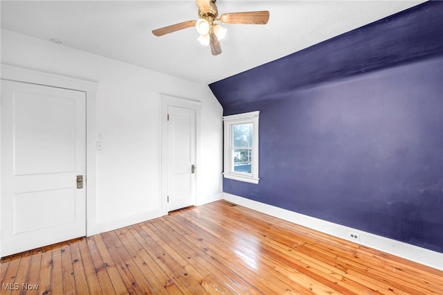 unfurnished bedroom with hardwood / wood-style floors and ceiling fan