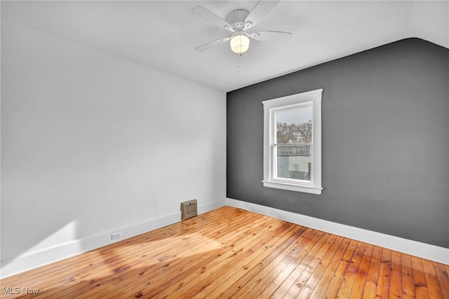 unfurnished room with hardwood / wood-style floors and ceiling fan