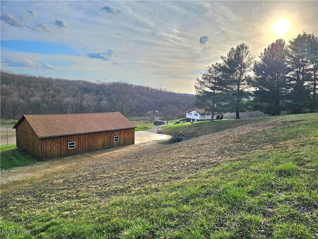 yard at dusk with an outbuilding