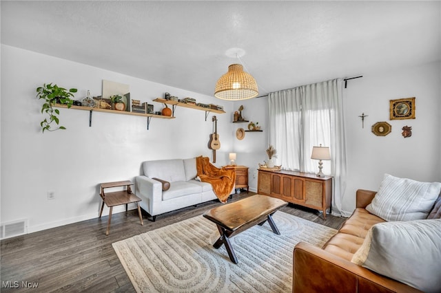 living room with dark hardwood / wood-style flooring