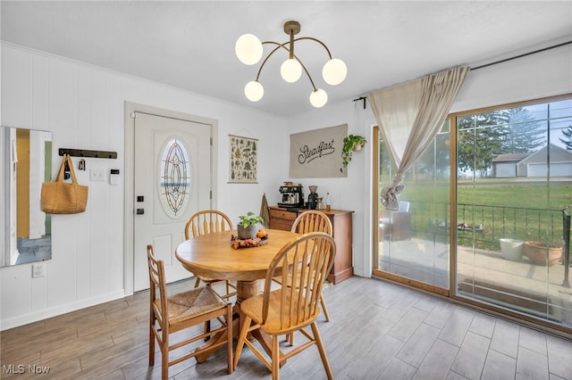 dining space featuring a notable chandelier and hardwood / wood-style flooring