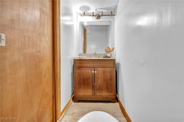 bathroom with vanity and a textured ceiling