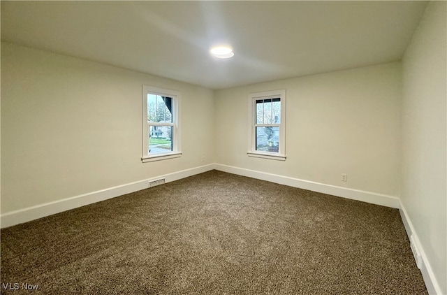 empty room with carpet flooring