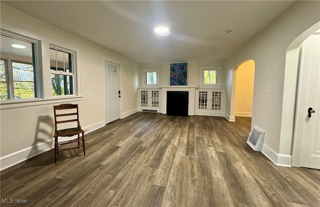 living room featuring dark wood-type flooring