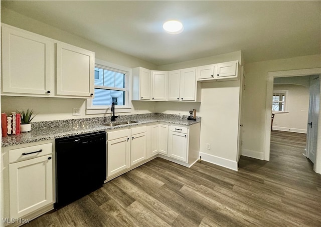 kitchen with dishwasher, sink, dark hardwood / wood-style flooring, light stone counters, and white cabinetry