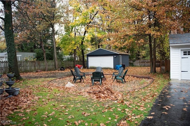 view of yard with a garage and an outdoor structure