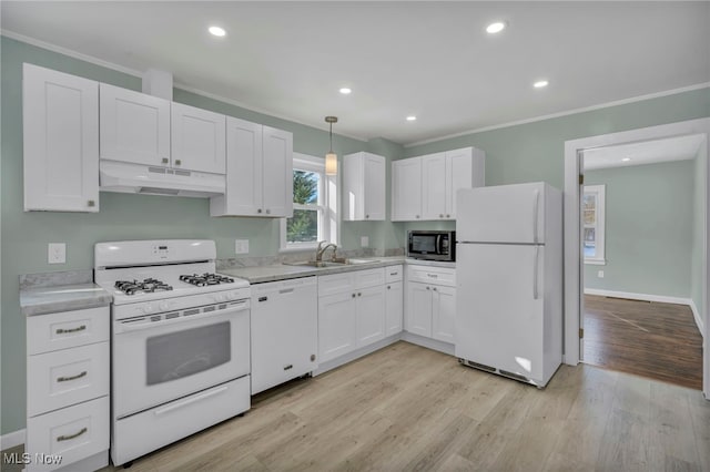 kitchen featuring white cabinetry, sink, light hardwood / wood-style floors, and white appliances