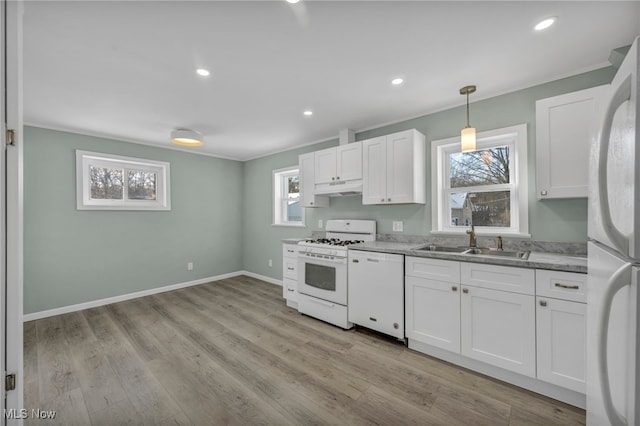 kitchen featuring light hardwood / wood-style floors, white cabinetry, white appliances, and sink