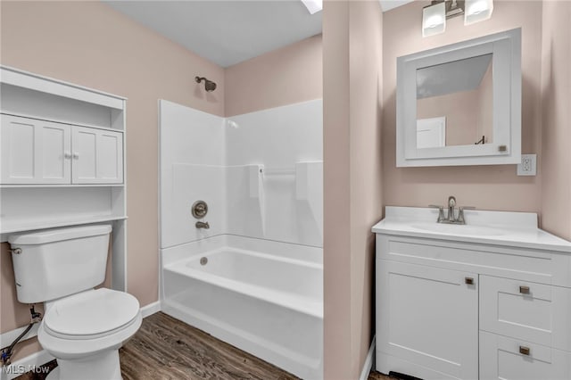 full bathroom featuring vanity, wood-type flooring,  shower combination, and toilet