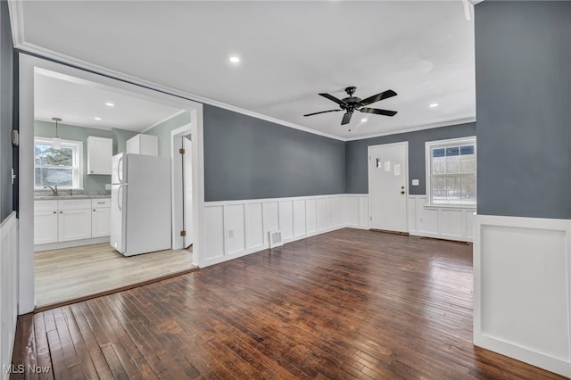 unfurnished living room with light hardwood / wood-style floors, plenty of natural light, and ceiling fan