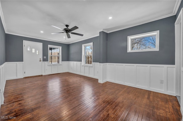 spare room featuring ceiling fan, dark hardwood / wood-style flooring, and ornamental molding