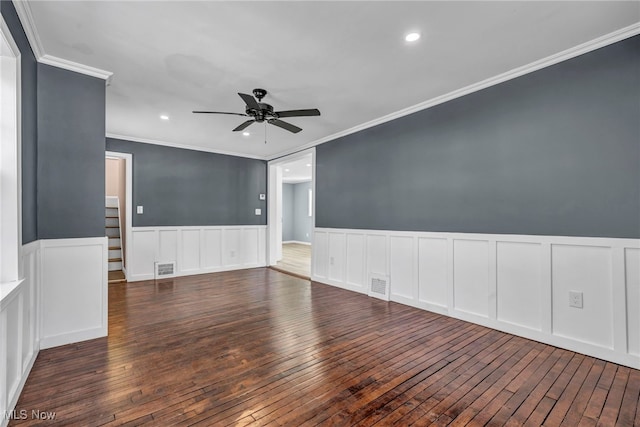 unfurnished room with ceiling fan, dark hardwood / wood-style flooring, and ornamental molding