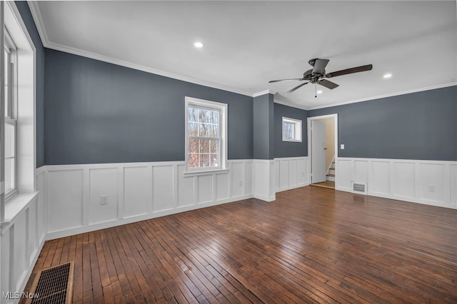 unfurnished room with dark wood-type flooring, ceiling fan, and crown molding