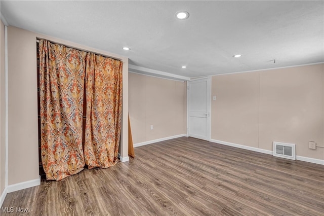 unfurnished room featuring wood-type flooring