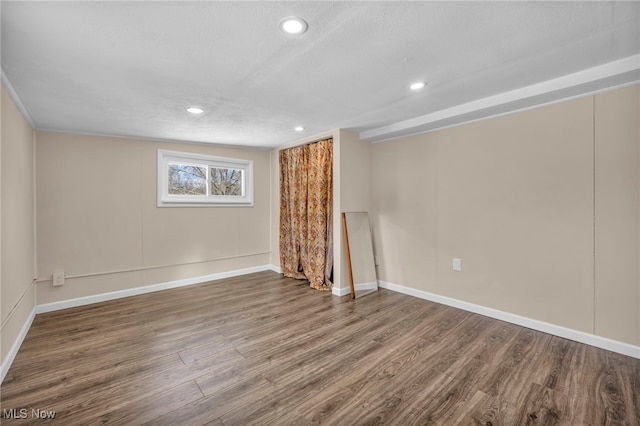 interior space with wood-type flooring and a textured ceiling