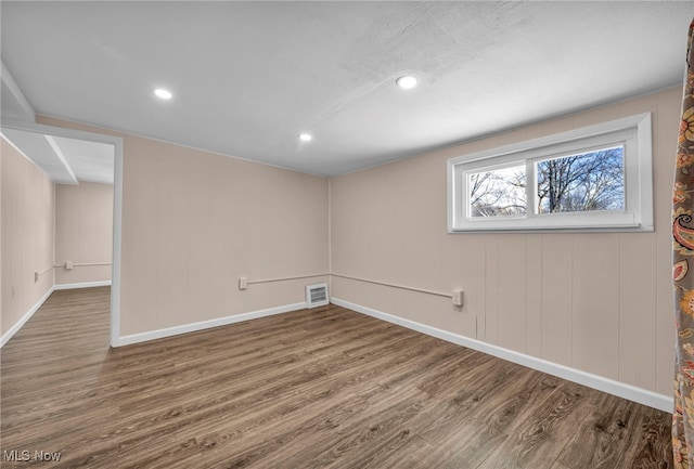 basement featuring hardwood / wood-style flooring