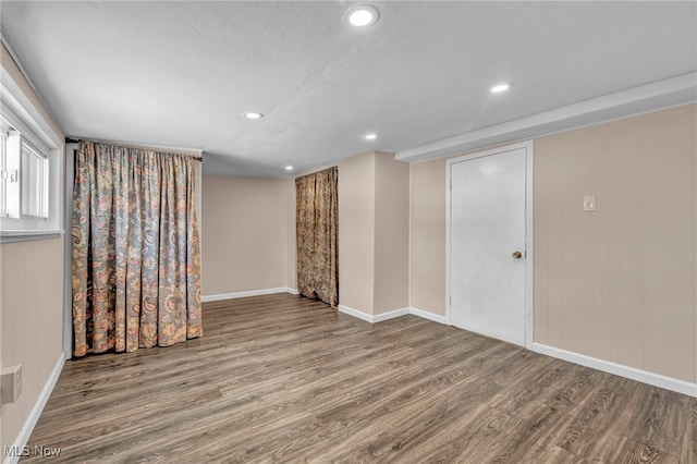 basement with hardwood / wood-style floors