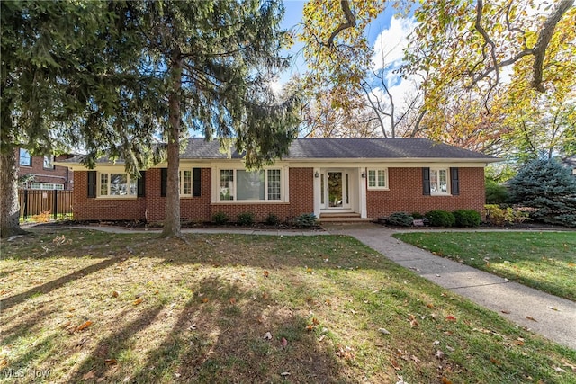 ranch-style house featuring a front lawn