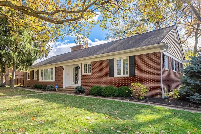 ranch-style house featuring a front lawn