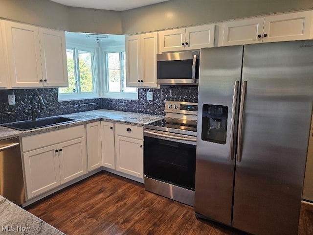 kitchen featuring sink, white cabinetry, and stainless steel appliances