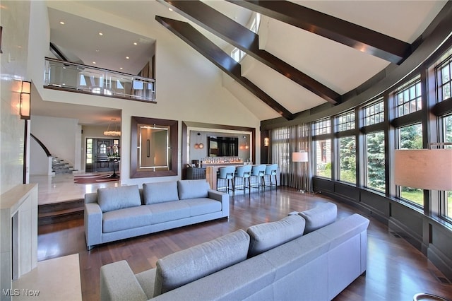 living room with beamed ceiling, high vaulted ceiling, and dark wood-type flooring