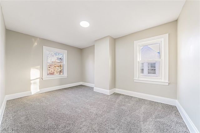 unfurnished room with carpet flooring