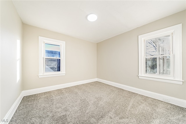 spare room featuring carpet floors