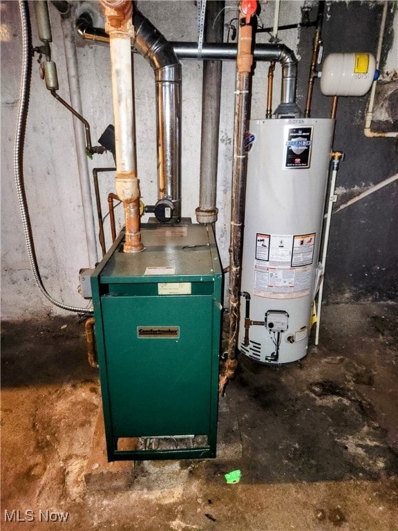 utility room featuring water heater