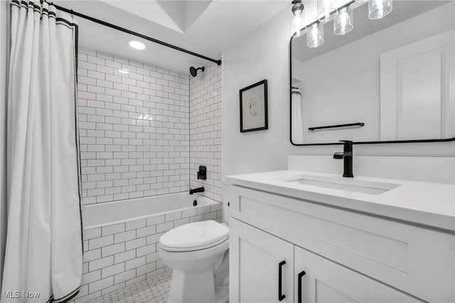 full bathroom with tile patterned flooring, vanity, toilet, and shower / bathtub combination with curtain