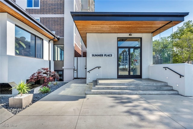 property entrance featuring french doors