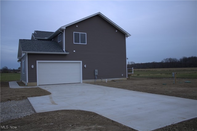 view of side of property featuring a garage