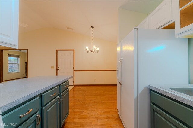 kitchen with white refrigerator with ice dispenser, light countertops, white cabinetry, light wood-type flooring, and green cabinetry