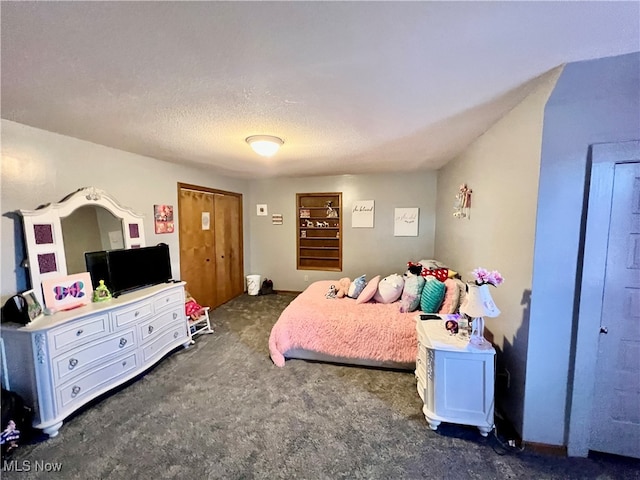 carpeted bedroom with a textured ceiling