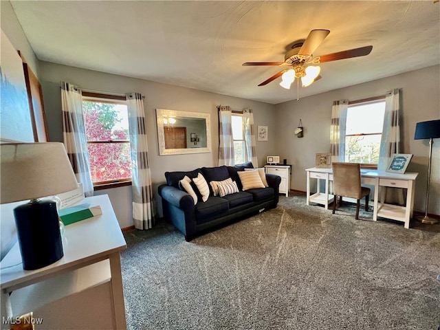 carpeted living room featuring ceiling fan