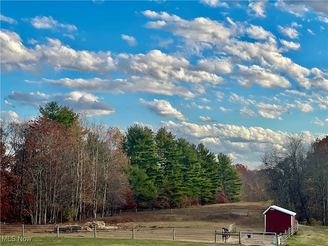 exterior space featuring a rural view and an outdoor structure