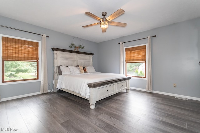 unfurnished bedroom featuring dark hardwood / wood-style floors and ceiling fan