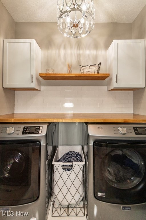 laundry area featuring cabinets and independent washer and dryer