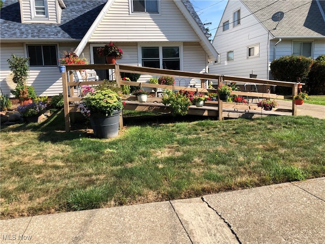 rear view of house with a lawn