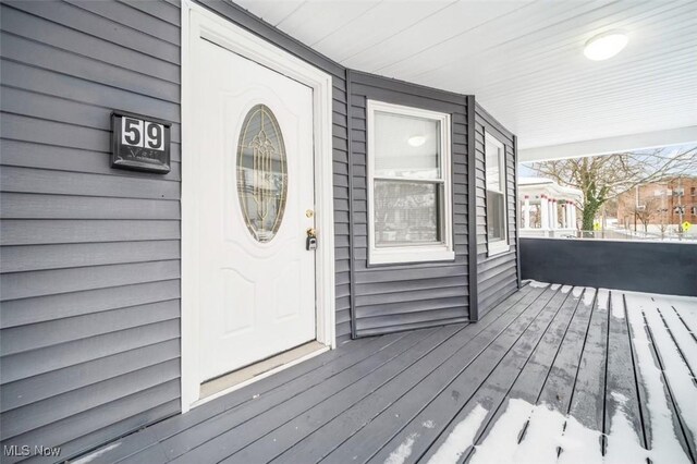 entrance to property featuring covered porch