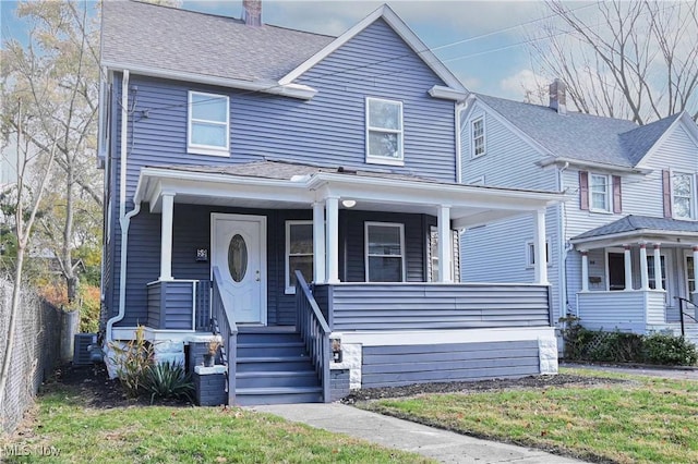 view of front of house featuring a porch, a chimney, a shingled roof, and central air condition unit