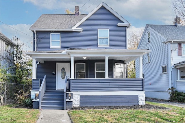 view of front of home featuring fence, a porch, and roof with shingles