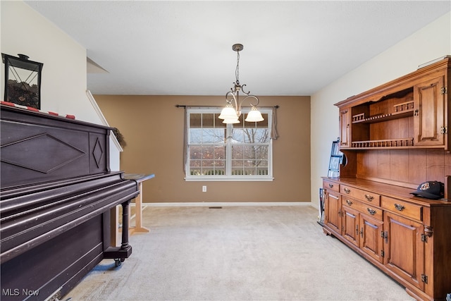 miscellaneous room with light carpet and a notable chandelier