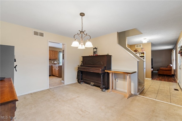 misc room with light carpet and a chandelier