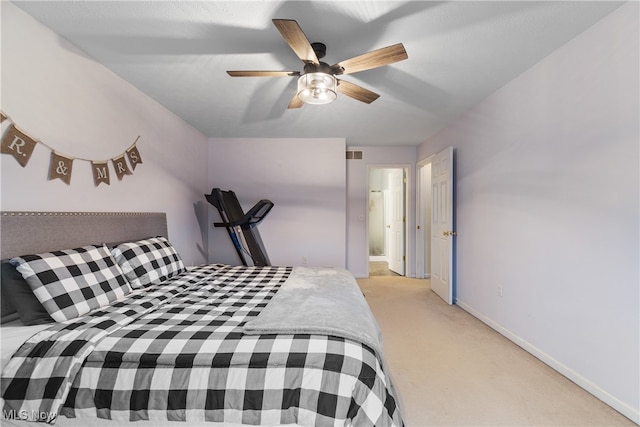 bedroom featuring light carpet and ceiling fan