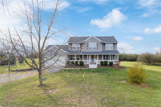 view of front facade with a front yard and a porch