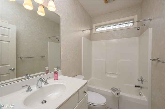 full bathroom with vanity, toilet, and bathtub / shower combination