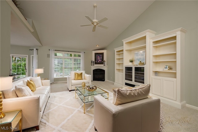 carpeted living room featuring ceiling fan and lofted ceiling