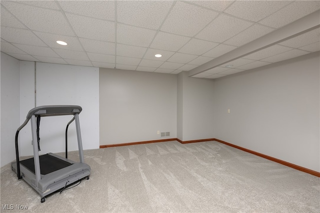 exercise area with carpet and a paneled ceiling