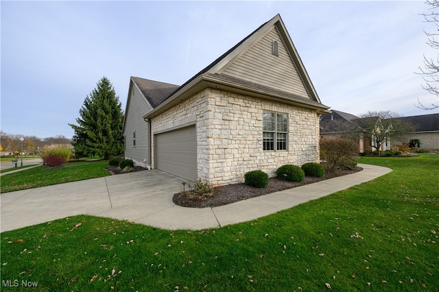 view of side of property with a garage and a lawn