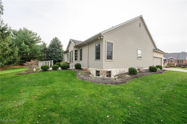 view of side of home with a yard